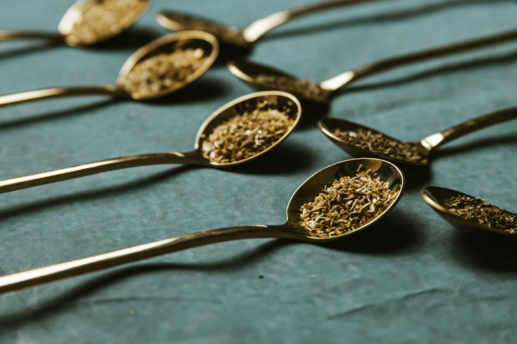 Spoons holding loose-leaf tea